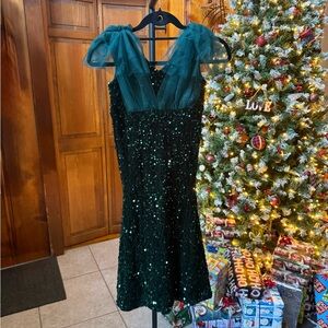 NWT. Girls size 7. Green Sequin Dress with Tulle Shoulders